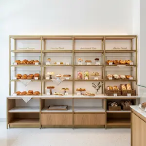 Rak Display Bakery Shelving Rangka Besi Finishing Brass dengan Kabinet Kayu